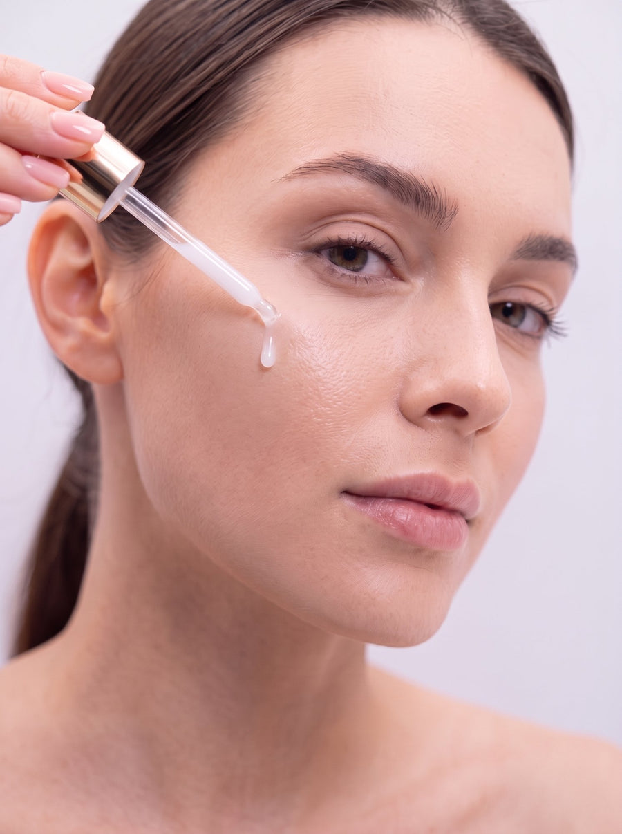 Applying Booster Serum with the dropper